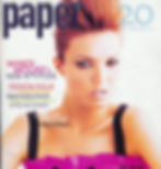 Magazine cover featuring a person with styled hair and dramatic eyeliner.